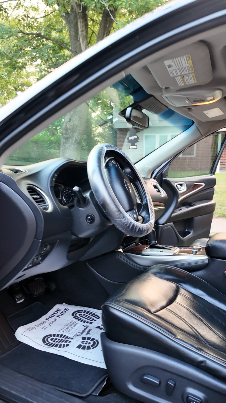 After: the same footwell cleaned, with a protective mat and wheel cover fitted