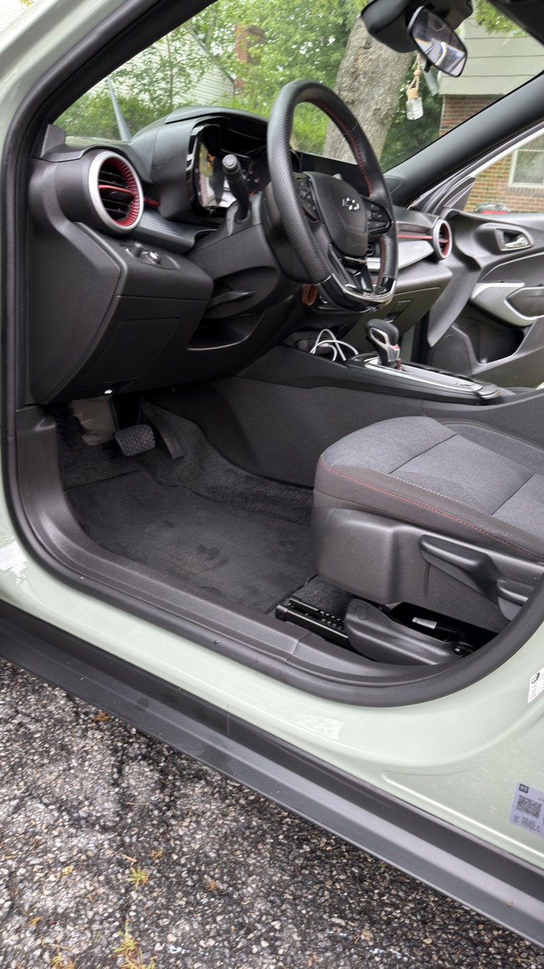 After: the same footwell and sill vacuumed and wiped clean
