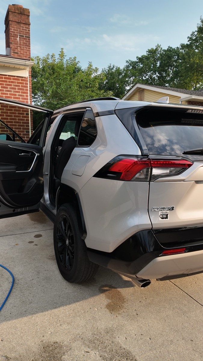 Toyota RAV4 rear quarter, doors open mid-detail