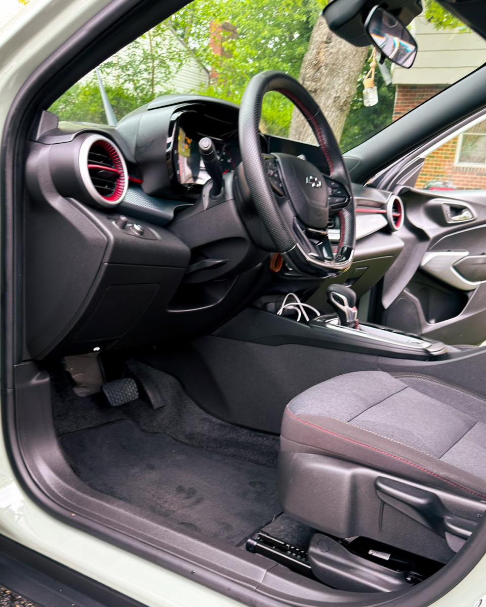 Driver-side dash, steering wheel and footwell after an interior detail