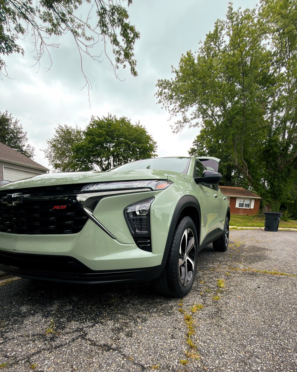 Freshly detailed sage-green Chevrolet Trax RS, front three-quarter view